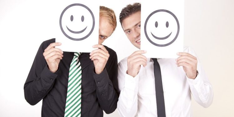 Мотивация на персонала в компанията 1 Multi-Ethnic Hands Holding Colorful Letters To Form Motivation